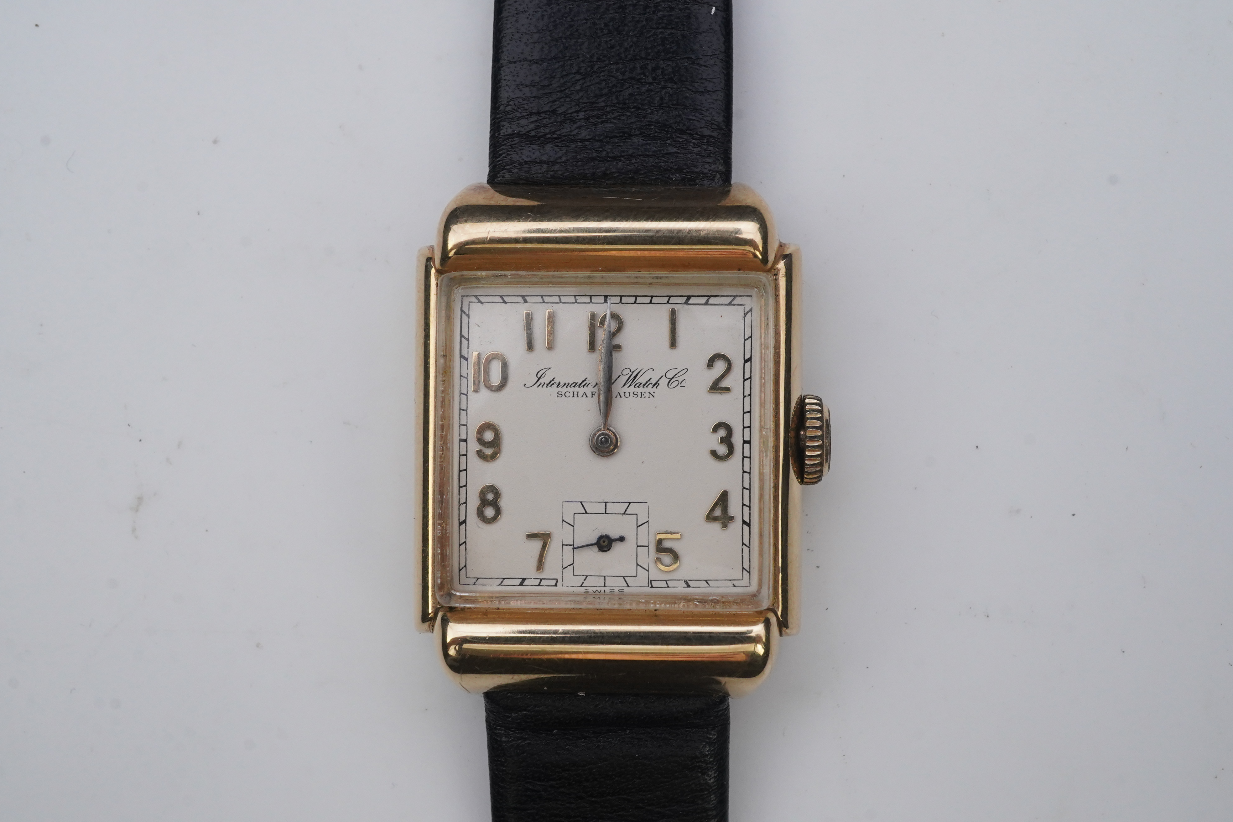 A gentleman's mid 20th century 14k gold International Watch Company manual wind wrist watch, on a later associated leather strap